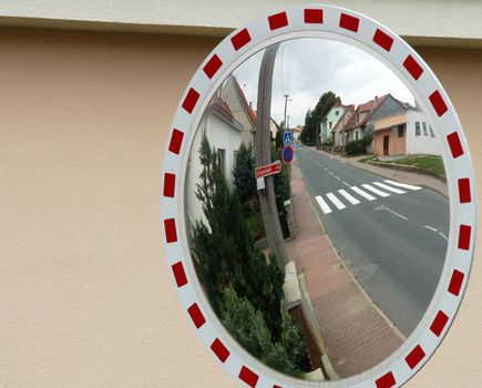 Mirror by the road for drivers to see behind the corner