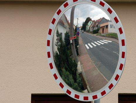 Mirror by the road for drivers to see behind the corner