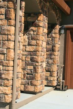 A row of brick columns in a new house.
