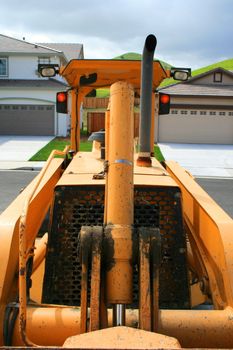 Close up of a bulldozer in a construction sight.
