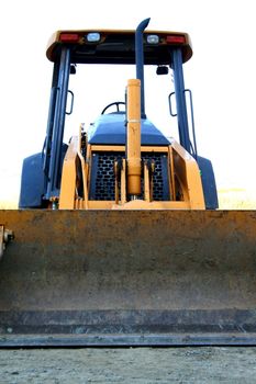 Bulldozer at the new house construction site. 