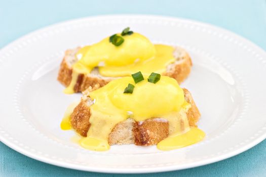 Poached eggs on with hollandaise sauce on toast.