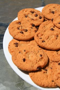 Close up of chocolate chip cookies on a plate.
