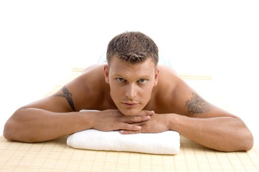 man relaxing in a spa on an isolated white background