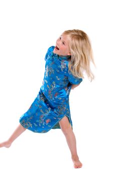 Beautiful four year old girl dancing on white background