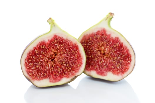 Two fresh figs on white background
