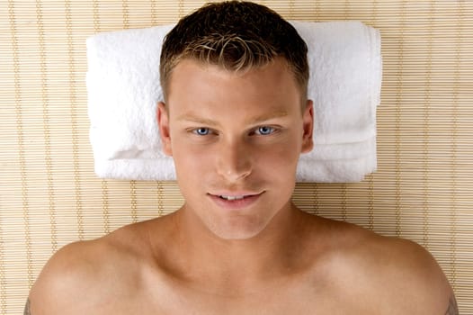 man relaxing in a spa salon on an isolated white background