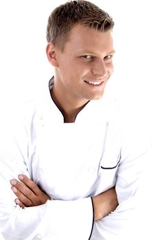 young chef posing with his arms crossed on an isolated white background