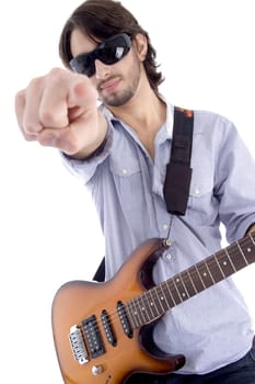 young rock star posing with guitar on an isolated white background