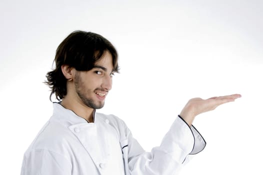 young chef with open palm on an isolated white background