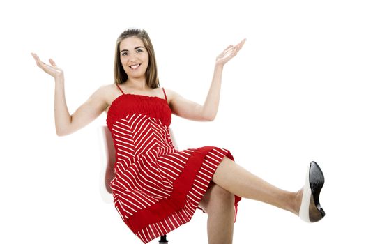 Young beautiful woman seated on a chair with a happy face