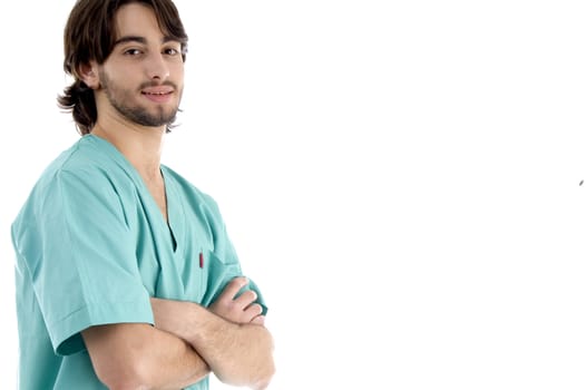 young surgeon posing with crossed arms on an isolated white background