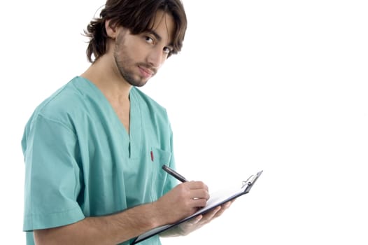 male doctor writing prescription against white background