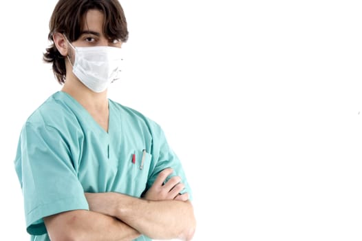 young surgeon posing with crossed arms on an isolated white background