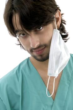 doctor in scrubs and facemask isolated on white background