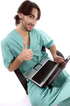 doctor working on laptop wishing goodluck against white background