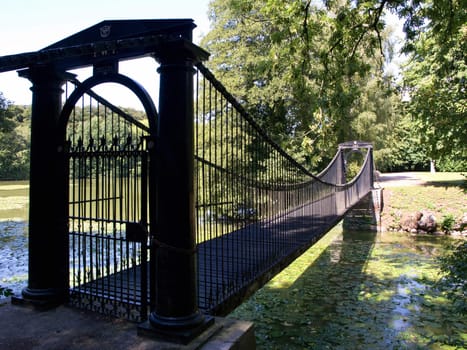 Old Steel footbridge in a country estate Denmark