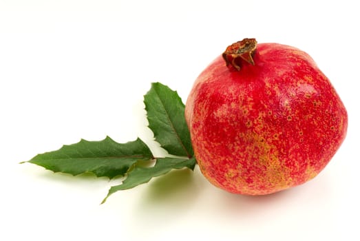 Pomegranate fruit, isolated on white background