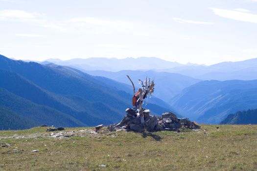Stones, variegated rags and Mountain panorama
