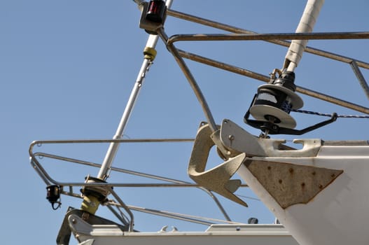 the prow of two sailboats in a dockyard