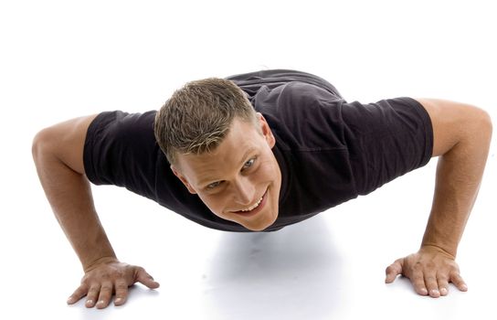 male doing push ups with white background