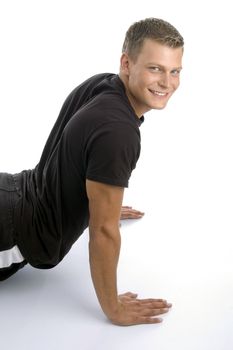 muscular man doing push ups on an isolated background