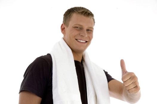 smiling man showing thumb gesture on an isolated background