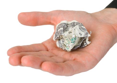 Male hand holding crumpled dollar photographed on a white background