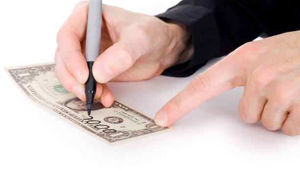 Male hand draw nil on dollar photographed on a white background