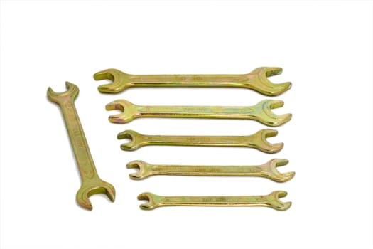 Isolated brass spanners over white
