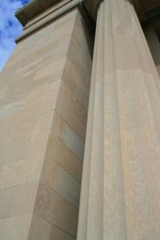 Close up of a big and tall column of a building.

