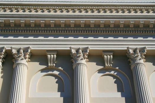 Row of columns showing unique architecture of a building.
