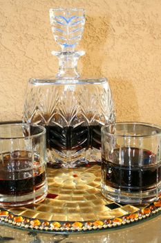 Crystal beverage set on a glass table.
