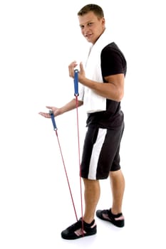 exercising man holding rope against white background