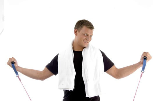 happy male with exercising rope on an isolated background