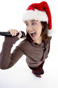 teen singer with mic and christmas hat on an isolated white background