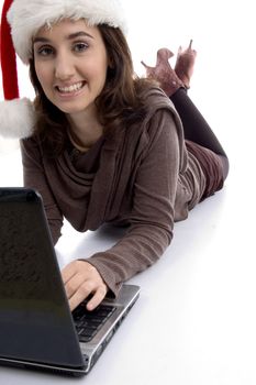 female lying on floor working on laptop on an isolated white background