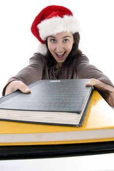 beautiful student in christmas hat with study material isolated on white background
