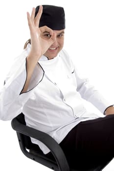 handsome chef with okay hand gesture on an isolated white background