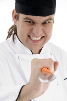 male chef showing kitchen tool with facial expressions on an isolated white background