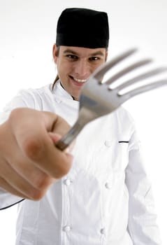 close up view of fork holding chef with white background