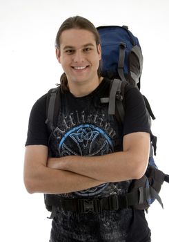 handsome guy ready for outing with backpack on an isolated white background