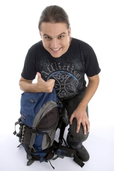 young traveler with backpack against white background