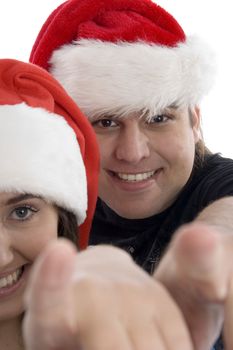 happy young couple wearing christmas hat with white background