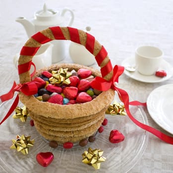 Baked marzipan cake formed as a basket, filled with candy