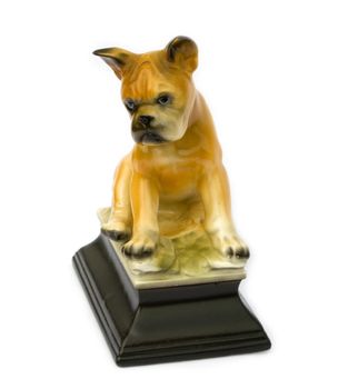 Retro vintage figurine of a boxer puppy isolated on white background