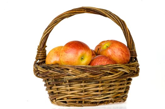 a basket with red apples