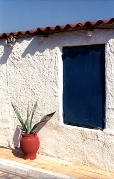 Fragment of a small house with closed window