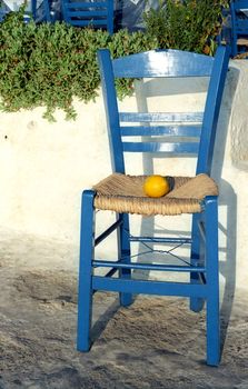 Blue chair with lemon on the seat