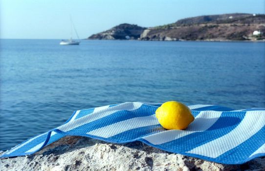 Lemon on the mat near sea shore